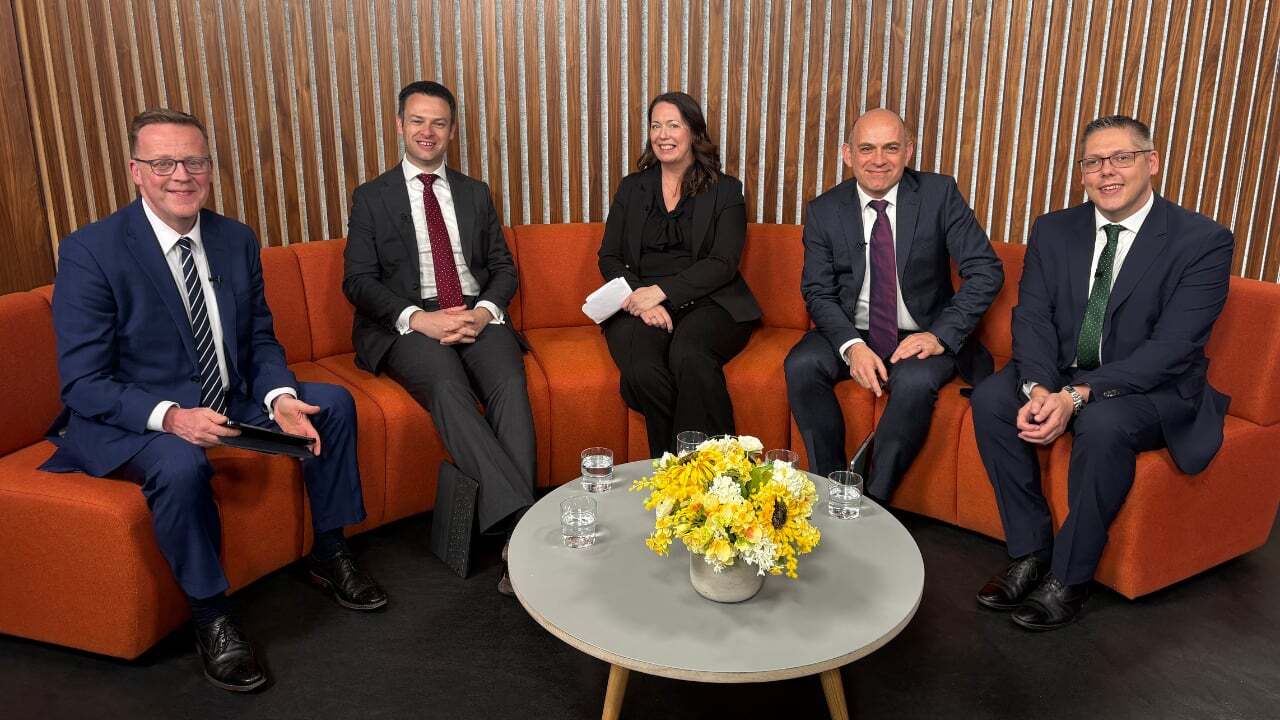 Panel of 4 men and 1 women sitting on a sofa